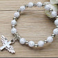 Pulsera con cruz y alas de ángel